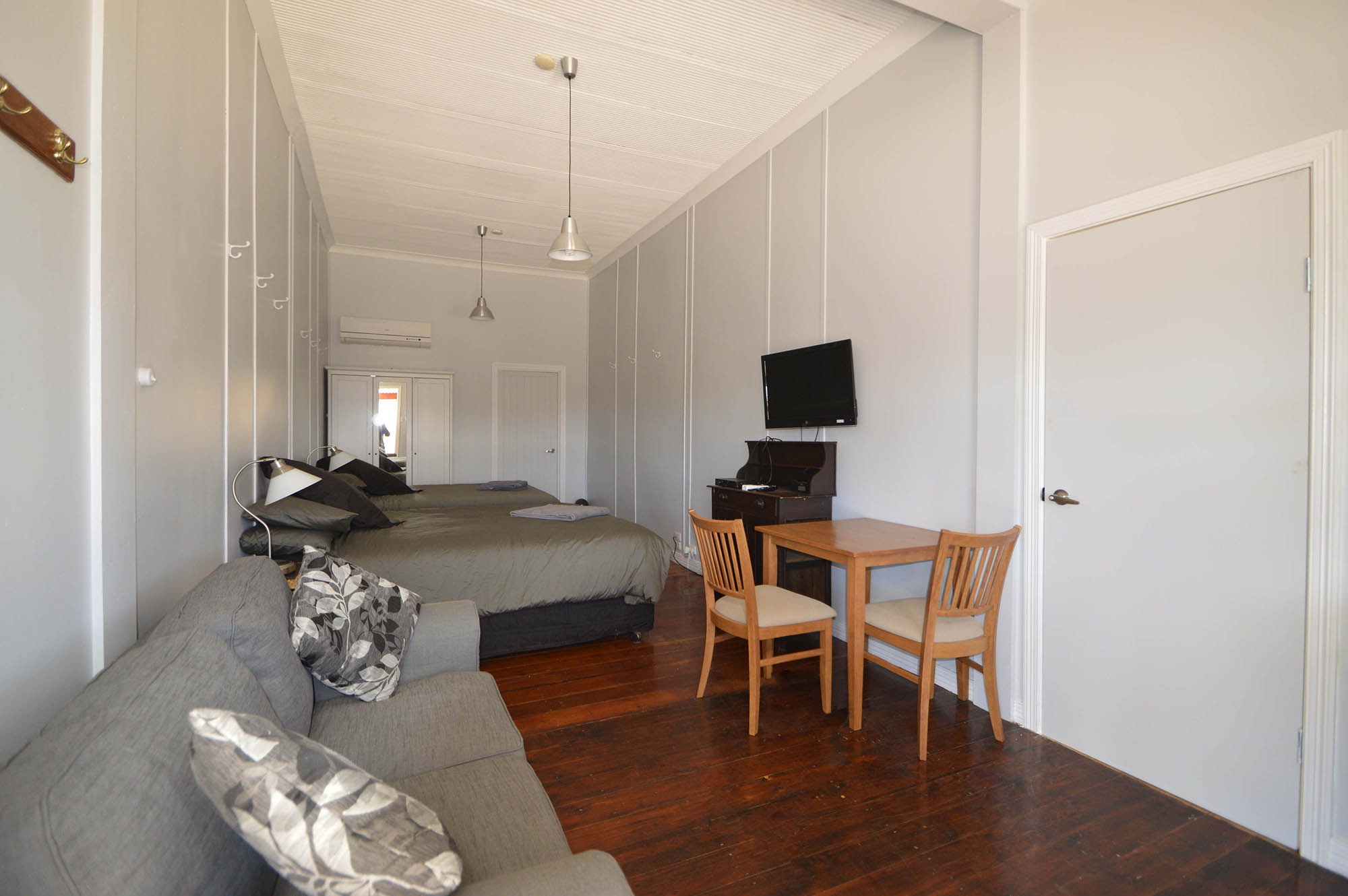 Standard Room 3 with a bed, sofa and dining table